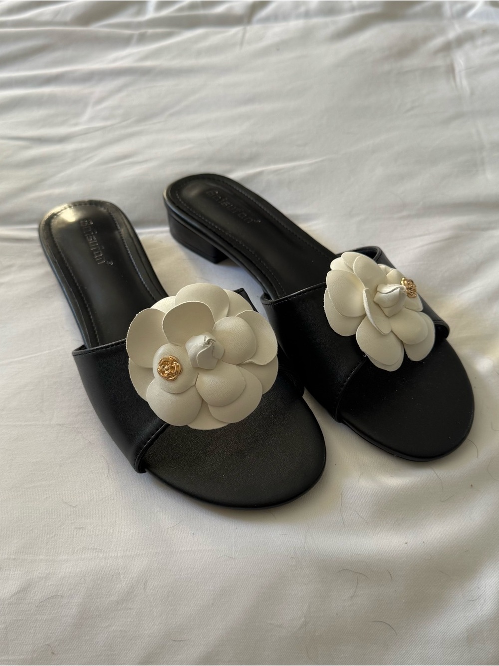 Black Slide Heeled Sandals with White Floral Accent and Gold Detail